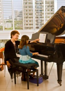 Piano Teacher with Child